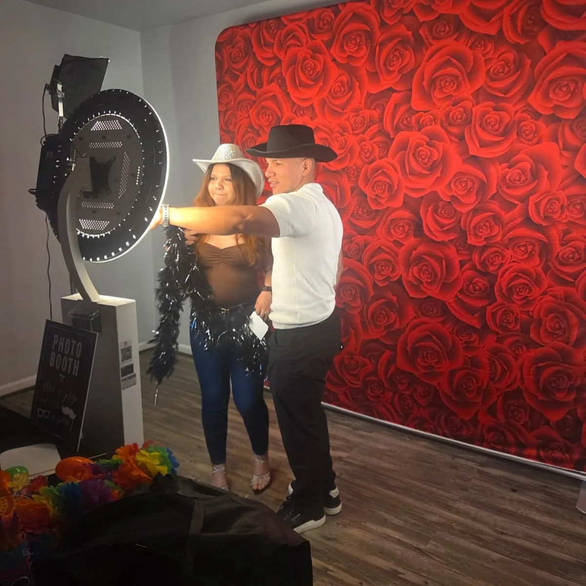 Guests lit by the LED ring of the mirror photo booth